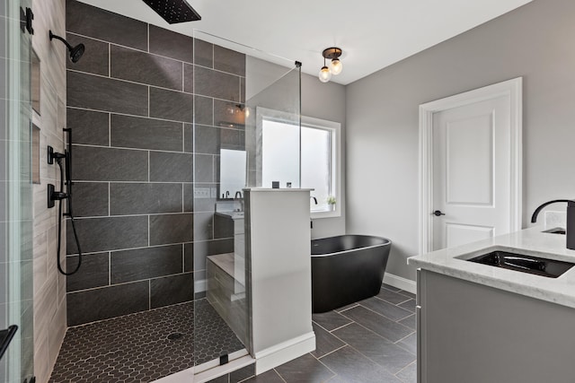 bathroom with shower with separate bathtub, vanity, and tile patterned floors