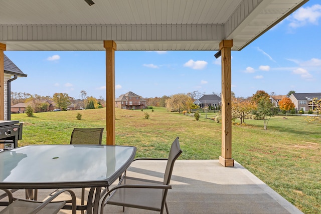 view of patio / terrace with a residential view and outdoor dining area