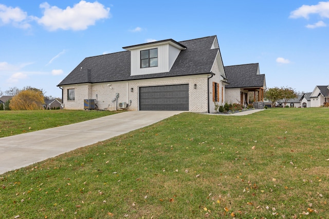 view of front facade featuring cooling unit, a garage, and a front lawn