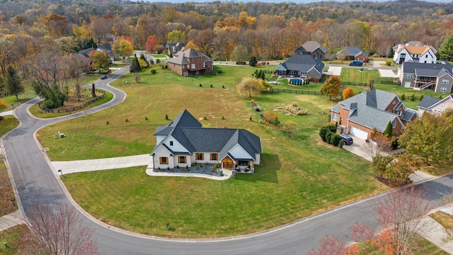 bird's eye view featuring a residential view and a view of trees