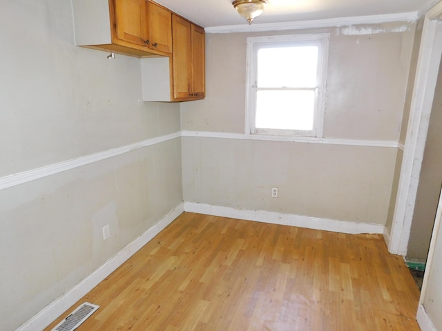 empty room with light hardwood / wood-style floors