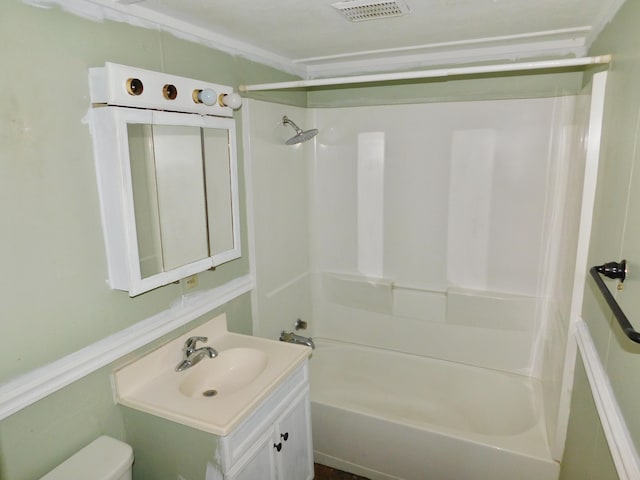 full bathroom with vanity, toilet, and  shower combination