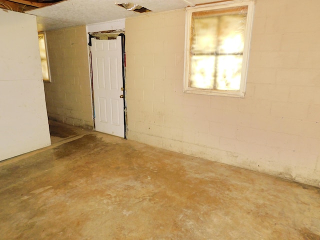 199 Caney Creek Rd, Stamping Ground, KY 40379 - unfurnished room featuring concrete block wall and unfinished concrete flooring
