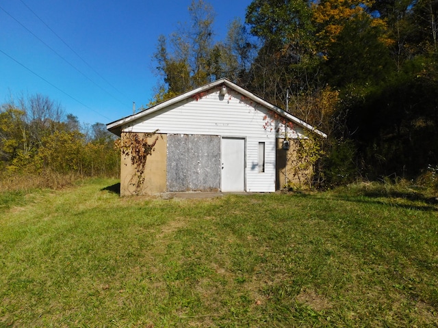 view of outdoor structure with a lawn