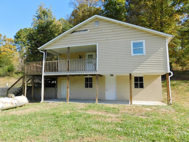 199 Caney Creek Rd, Stamping Ground, KY 40379 - back of house featuring a lawn, a patio, stairway, and a wooden deck