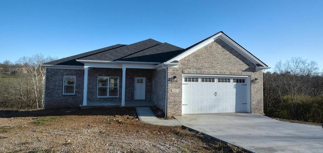 view of front facade with covered porch and a garage