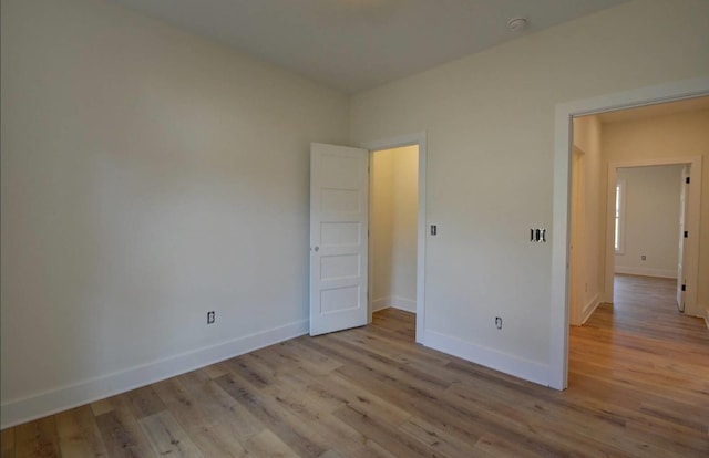 spare room featuring light wood-type flooring