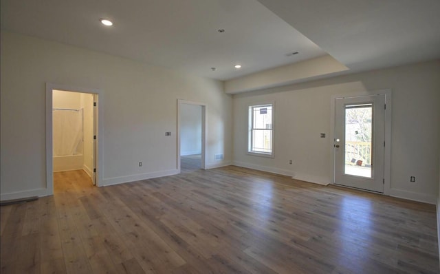 unfurnished room with light wood-type flooring