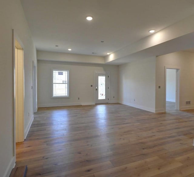 unfurnished room featuring wood-type flooring