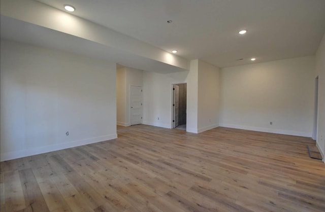 unfurnished room featuring light hardwood / wood-style flooring