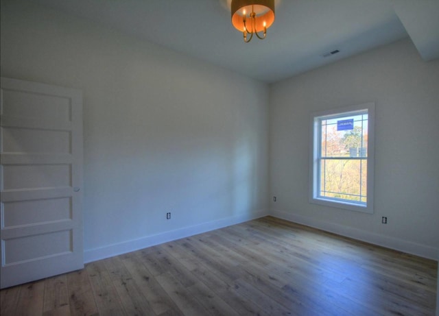 unfurnished room with light hardwood / wood-style flooring