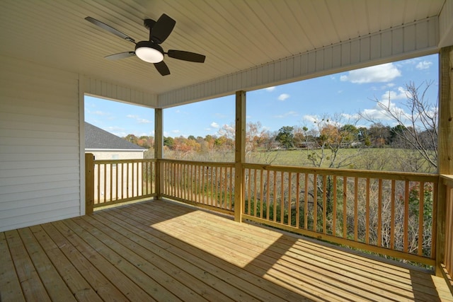 wooden terrace featuring ceiling fan