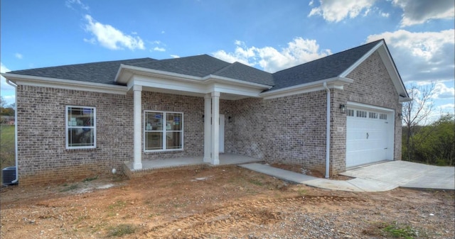 view of front of house featuring covered porch and a garage