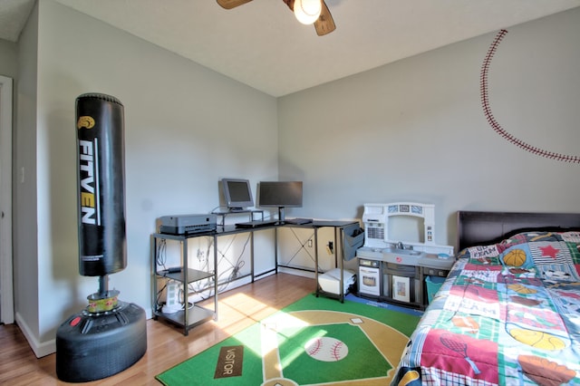 bedroom with wood-type flooring and ceiling fan