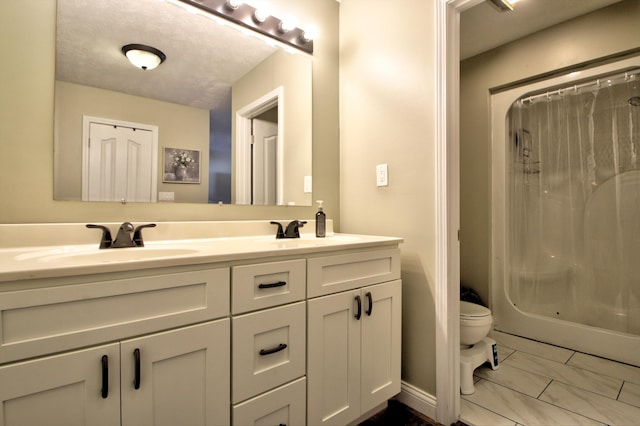 full bathroom featuring vanity, shower / tub combo with curtain, and toilet