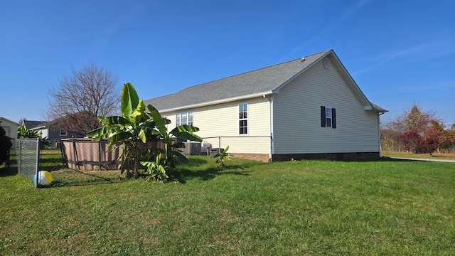 view of property exterior featuring a lawn