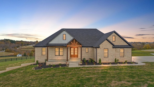 view of front of house with a yard