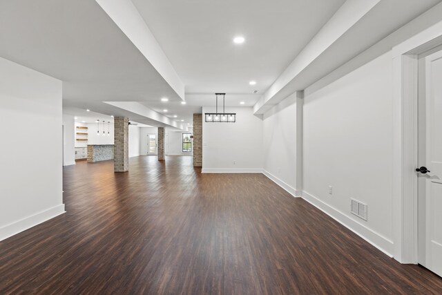 unfurnished bedroom with ceiling fan and dark hardwood / wood-style flooring