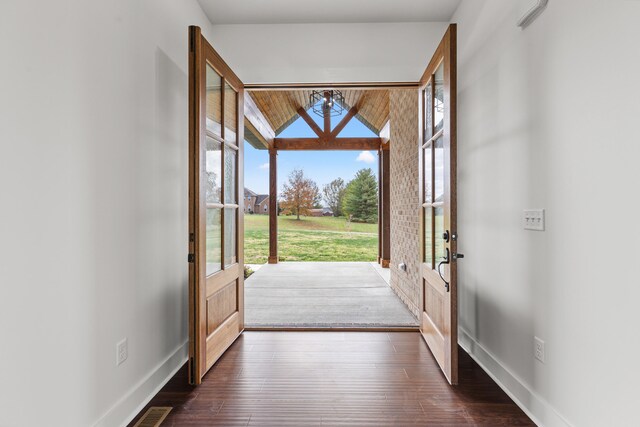 view of exterior entry featuring a patio area