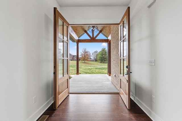 doorway with dark wood-type flooring and french doors