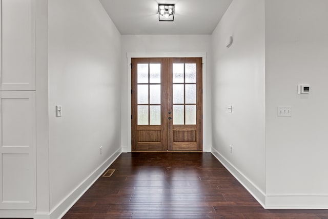 doorway to outside featuring dark wood-type flooring and french doors