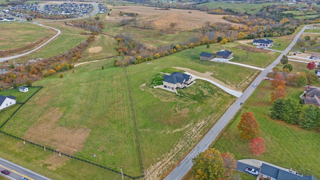 birds eye view of property featuring a rural view