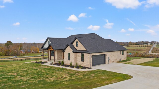 birds eye view of property with a rural view