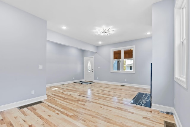 spare room featuring light hardwood / wood-style floors