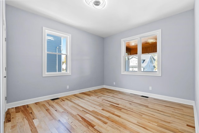 unfurnished room featuring light wood-type flooring