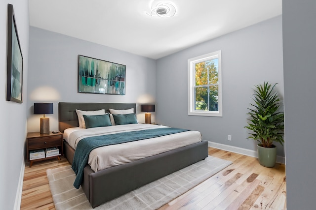 bedroom with light hardwood / wood-style flooring