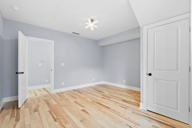 unfurnished room with light hardwood / wood-style floors