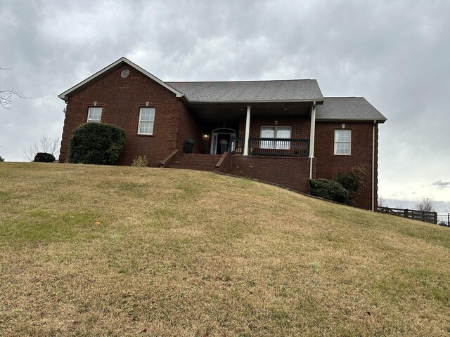 view of property exterior with a lawn