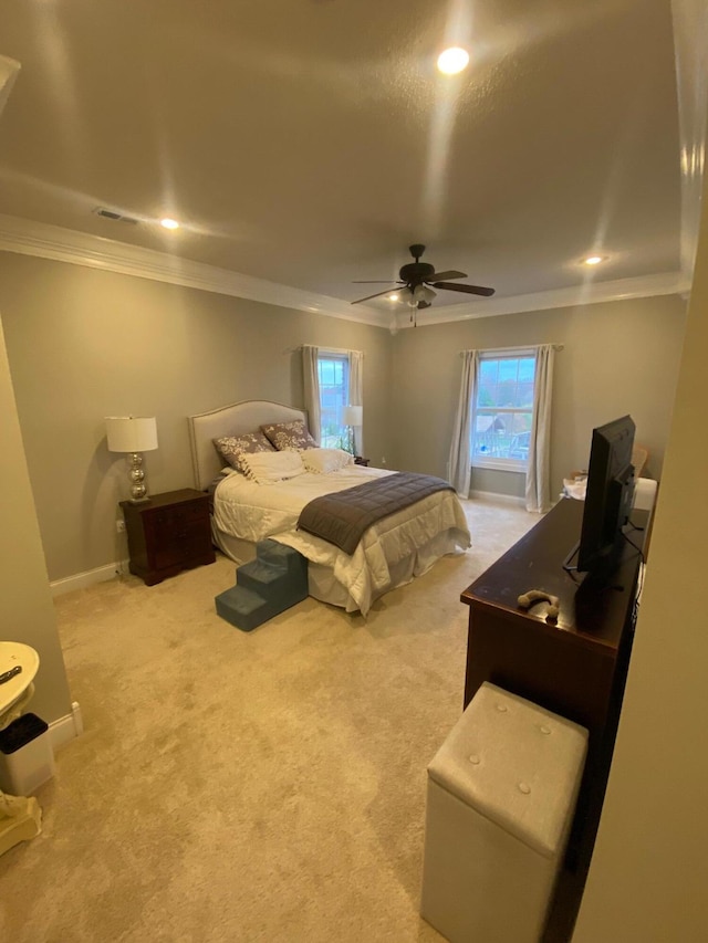 bedroom with carpet flooring, ceiling fan, and multiple windows