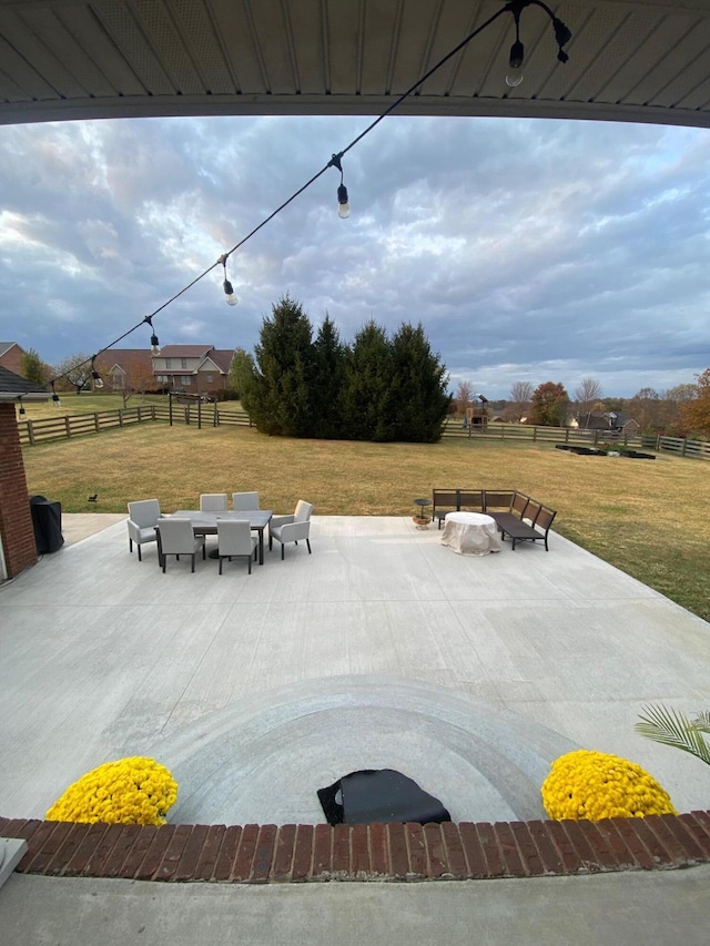 view of patio / terrace featuring a fire pit and a rural view