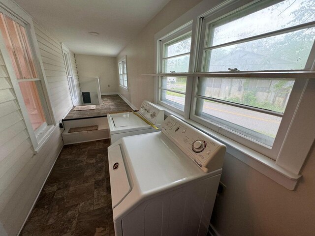 washroom with washing machine and clothes dryer