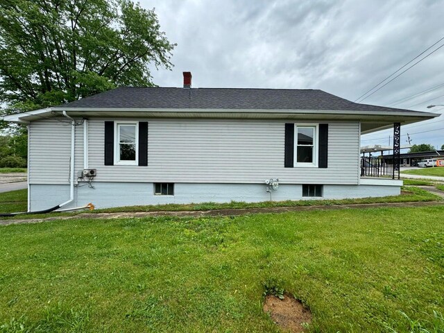 view of home's exterior featuring a yard