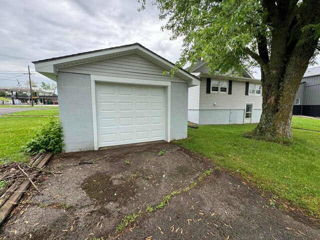 garage with a yard