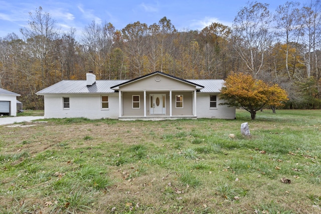 223 Sycamore Rd, Stanton, KY 40380 - view of front of house featuring brick siding, a porch, a chimney, and metal roof