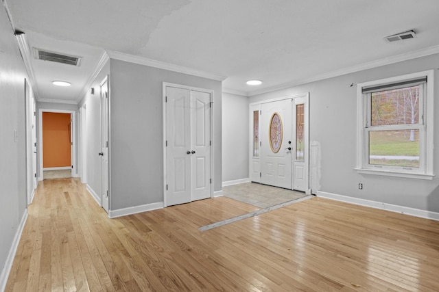223 Sycamore Rd, Stanton, KY 40380 - foyer with light wood finished floors, crown molding, visible vents, and baseboards