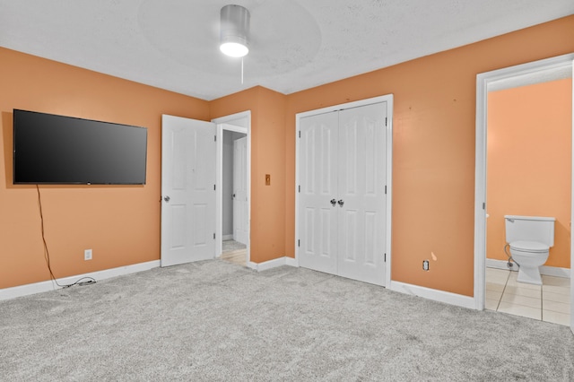 223 Sycamore Rd, Stanton, KY 40380 - unfurnished bedroom featuring carpet, ensuite bathroom, a closet, and baseboards