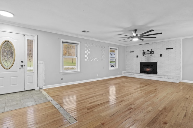 223 Sycamore Rd, Stanton, KY 40380 - unfurnished living room featuring ceiling fan, crown molding, light wood-type flooring, and visible vents