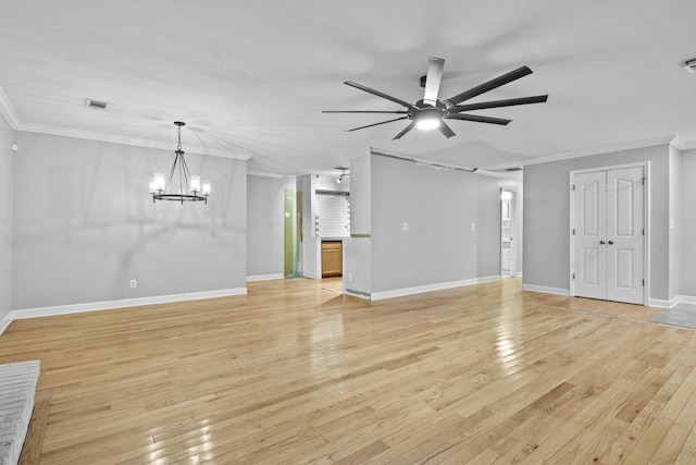 223 Sycamore Rd, Stanton, KY 40380 - unfurnished living room featuring crown molding, light wood-style flooring, ceiling fan with notable chandelier, and visible vents