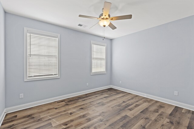 laundry area with hookup for an electric dryer and dark hardwood / wood-style floors