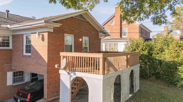 rear view of house featuring a deck