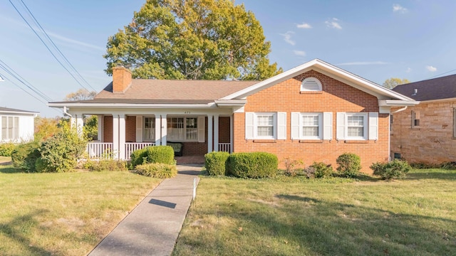 view of front of home with a porch and a front yard