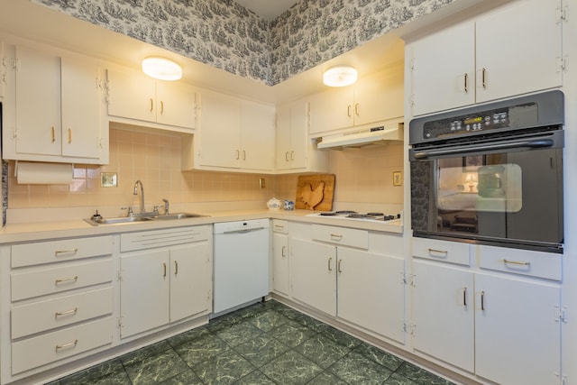 kitchen with white cabinets, white appliances, sink, and tasteful backsplash