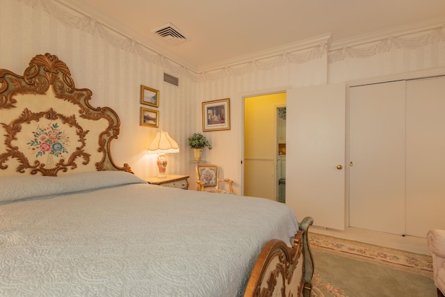 carpeted bedroom featuring a closet