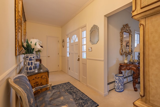 foyer with a baseboard heating unit, light carpet, and crown molding