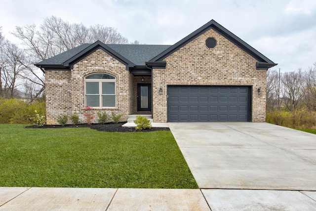 view of front of house featuring a front yard and a garage