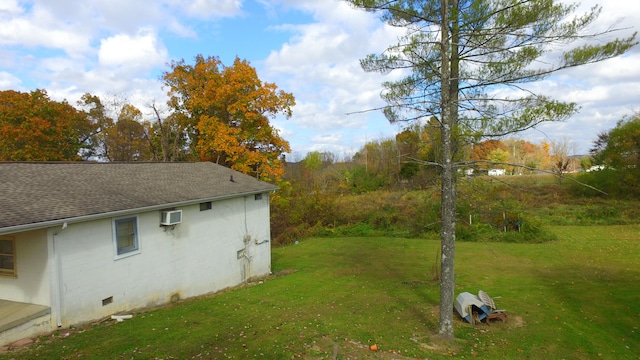 view of yard featuring an AC wall unit